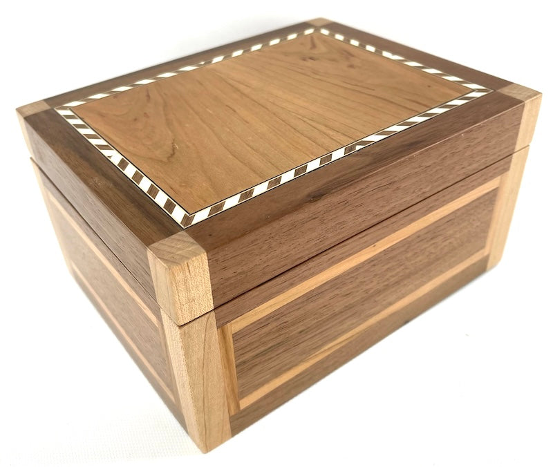 Custom made from Cherry, Oak and Black Walnut box with wooden hinge and Black felt interior. Black Walnut wooden hinge. Rope inlay border in cherry wood lid. Vertical edges are maple wood. Red and Blue felt inserts. - TreeToBox