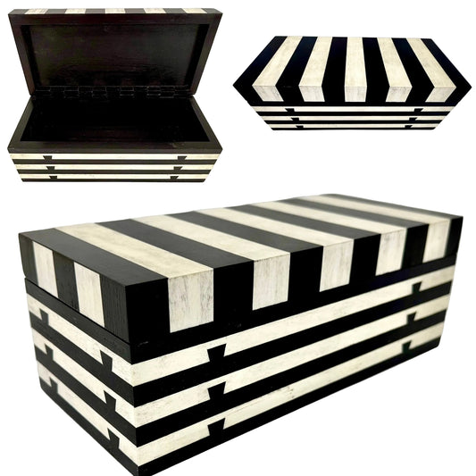 A Black and white storage box shown in a three-view collage on a white background. The main view shows the closed chest with alternating black and off-white horizontal stripes; the top-left inset shows the lid open, revealing a black interior; the top-right inset shows the lid from above with the stripe pattern. - TreeToBox